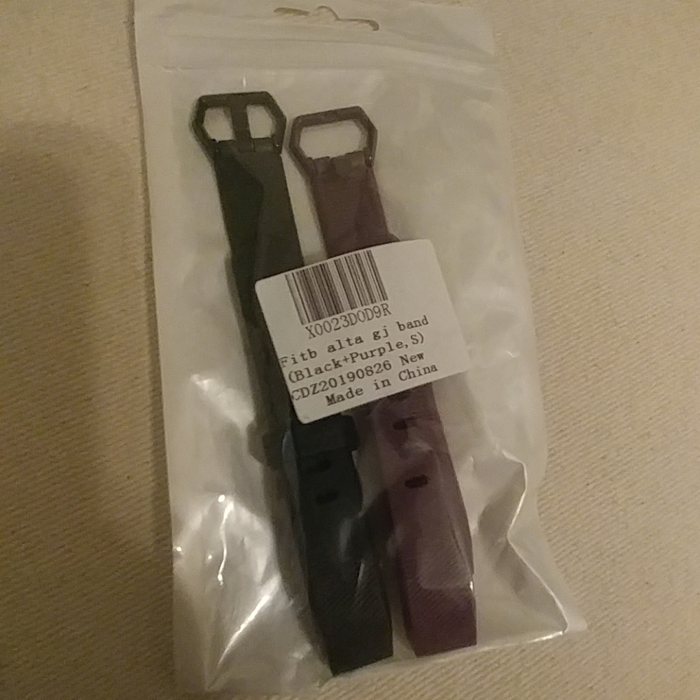 Black and purple Fitbit Alta HR bands